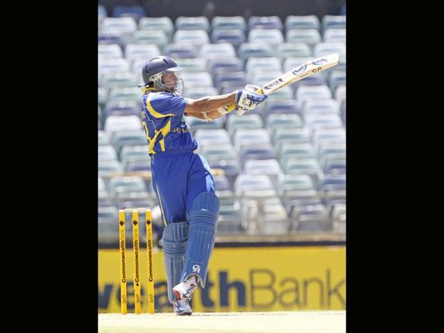 Tillakaratne Dilshan hits the ball for four runs off a delivery from Vinay Kumar during their one day cricket match in Perth. Reuters