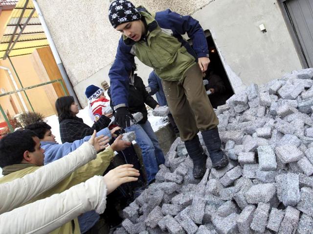 Banknotes, shredded and compressed into heating fuel, are distributed at the Foundation to Help Autism in Miskolc, eastern Hungary. Reuters/Laszlo Balogh