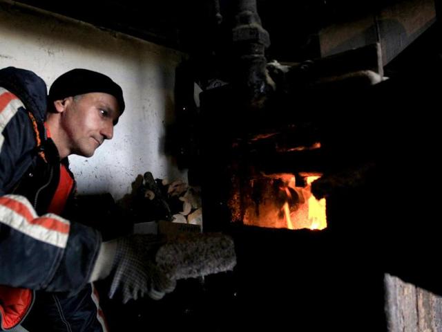 Banknotes are burned as heating fuel at the Foundation to Help Autism in Miskolc, eastern Hungary.
