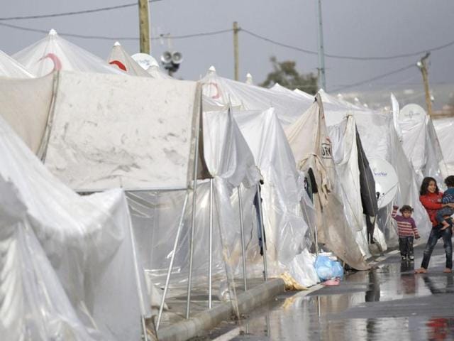 Syrian children stand next to their tents at the Boynuyogun refugee camp on the Turkish-Syrian border in Hatay province. Reuters Photo/Murad Sezer