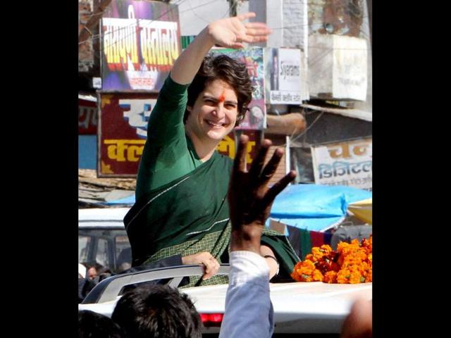 Priyanka Gandhi Vadra waves to the crowd during her election campaign in Salon, Amethi. PTI/Atul Yadav