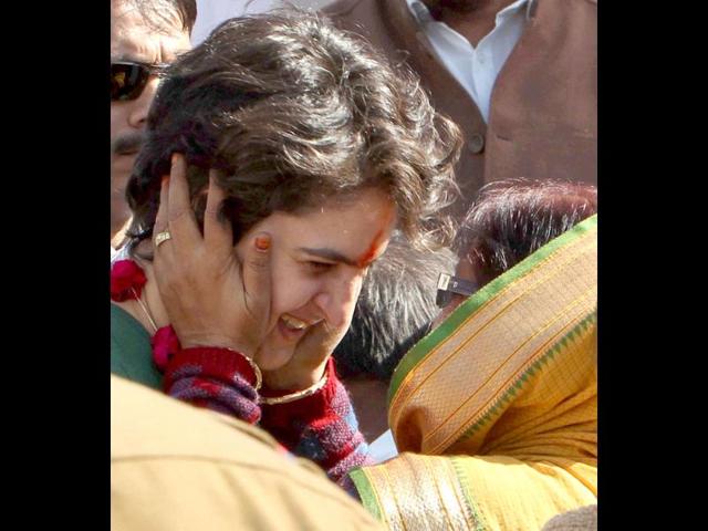 A woman shows her affection towards Priyanka Gandhi Vadra during her election campaign in Salon, Amethi. PTI/Atul Yadav