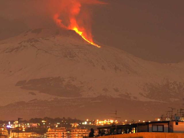 Mount Etna spews lava on the southern Italian island of Sicily. Mount Etna is Europe's tallest and most active volcano. REUTERS/Antonio Parrinello