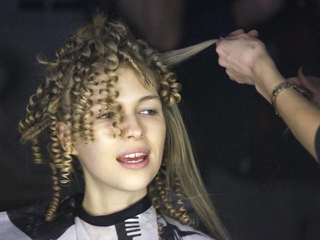A model is made up backstage before the Cynthia Rowley Fall/Winter 2012 collection show during New York Fashion Week. Reuters