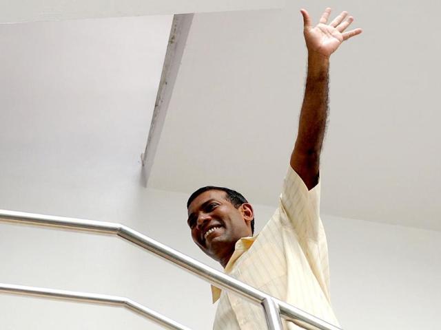 Former Maldives president Mohamed Nasheed waves after Friday prays at his home in Male. AFP photo