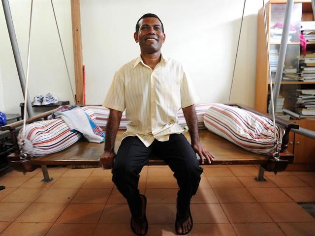 Former Maldives president Mohamed Nasheed rests after Friday prayers at his home in Male. AFP photo
