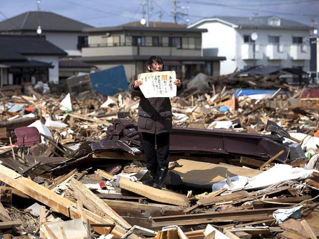 Yasuyoshi Chiba of Japan, a photographer working for Agence France-Presse, has won the first prize People in the News Stories with the "Aftermath of the tsunami" series. REUTERS/Yasuyoshi Chiba