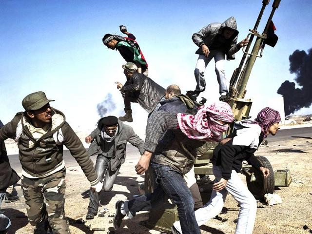 Yuri Kozyrev of Russia, a Noor Images photographer working for Time, has won the first prize Spot News Singles with this picture of rebels in Ras Lanuf, Libya. REUTERS/Yuri Kozyrev
