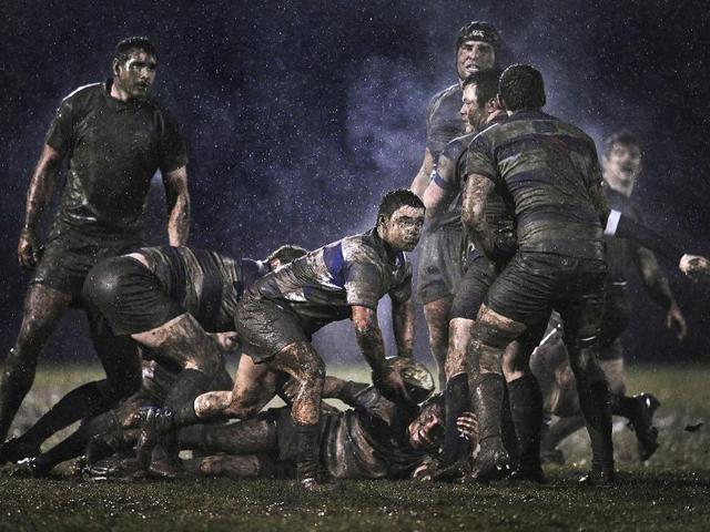 Ray McManus of Ireland, a photographer working for Sportsfile, has won the second prize Sports Singles with this action picture from a rugby match between Old Belvedere and Blackrock played in heavy rain in Dublin, Ireland. REUTERS/Ray McManus
