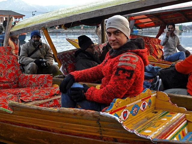 Bollywood actor Aamir Khan rides in a 'shikara', a Kashmiri boat, during his visit to Srinagar on Thursday to explore shooting locations. Check out the pics.