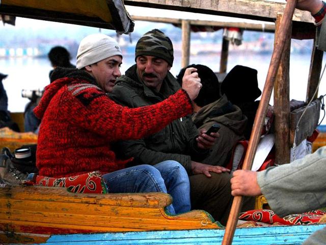 Aamir Khan rides in a 'shikara', a Kashmiri boat, during his visit to Srinagar on Thursday to explore shooting locations.
