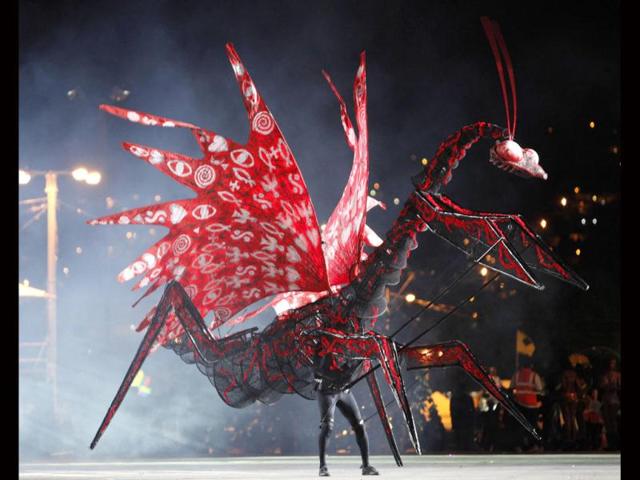 Gerard Weekes portrays the theme titled Malak Yahweh-The Praying Mantis, on the stage at Queen's Park Savannah during the preliminaries of the King and Queen of Carnival competition in Port of Spain. Twenty semi-finalists were chosen from the 74 competitors from each of the king and queen categories, to go on to the next round. REUTERS/Andrea De Silva