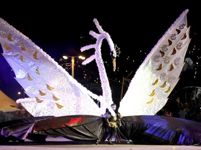Brian Chin presents the theme Prince Sigfried: The Story Of Swan Lake-Tribute to Wayne Berkley, on the stage at Queen's Park Savannah during the preliminaries of the King and Queen of Carnival competition in Port of Spain. Twenty semi-finalists were chosen from the 74 competitors from each of the king and queen categories, to go on to the next round. REUTERS/Andrea De Silva