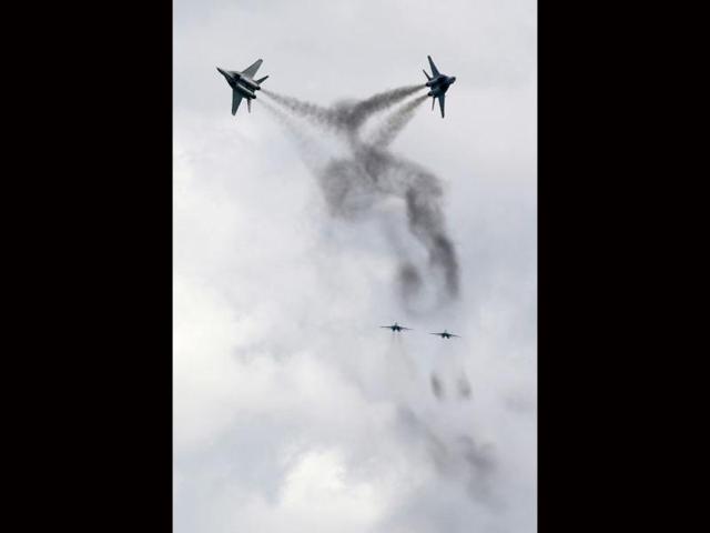 Jets of the Royal Malaysian Air force MIG 29 team perform a manoeuvre during a media preview of the Singapore Airshow in Singapore. The aviation trade event takes place from February 14 to 19. Reuters/Edgar Su
