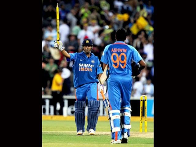 India-s-Rohit-Sharma-R-celebrates-with-MS-Dhoni-L-after-taking-the-wicket-of-Australia-s-Michael-Clarke-during-their-one-day-series-cricket-match-at-the-Melbourne-Reuters-Brandon-Malone