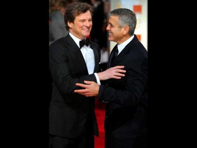 King's Speech actor Colin Firth and The Descendants actor George Clooney caught in a light moment at the awards.
