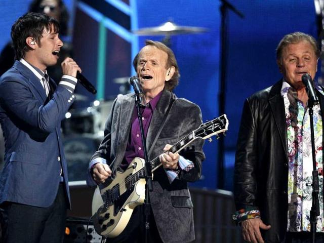 Mark Derek Foster of the band Foster the People, Al Jardine and Bruce Johnston of the band Beach Boys perform during the music awards.