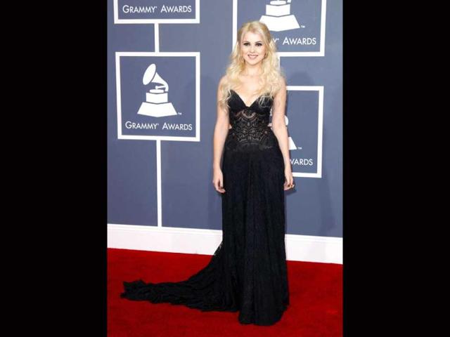 Mika Newton looks pretty in a black gown with plunging neckline.