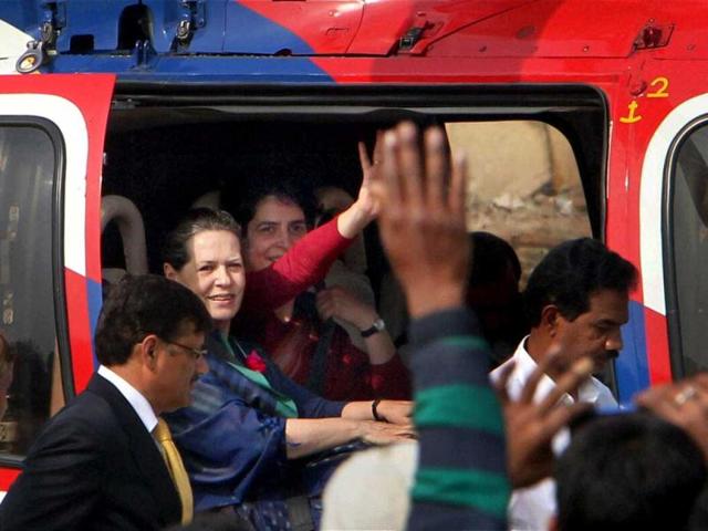 UPA Chairperson Sonia Gandhi and her daughter Priyanka Gandhi Vadra sit in an helicopter after an election campaign rally in Raebareli. PTI Photo by Atul Yadav