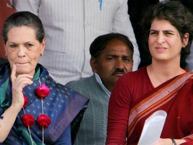 UPA Chairperson Sonia Gandhi gestures as Priyanka Gandhi Vadra looks on during an election campaign in rally in Raebareli. PTI Photo/Atul Yadav