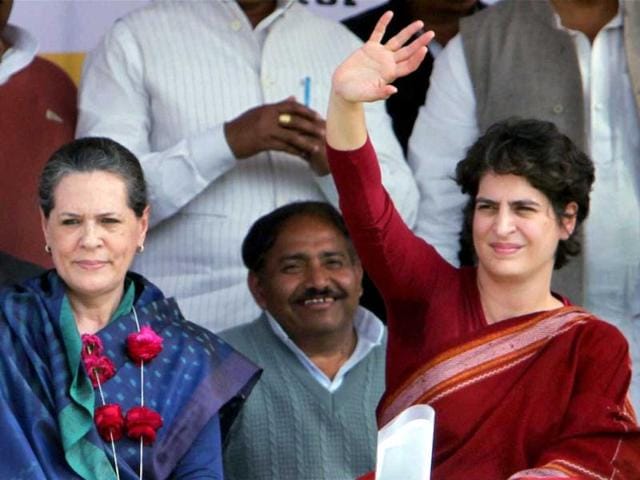 Priyanka Gandhi Vadra waves at an election campaign rally with her mother and UPA chairpaerson Sonia Gandhi in Raebareli. PTI Photo/Atul Yadav