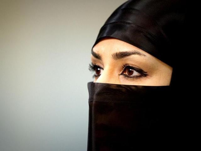 A Ninjutsu practitioner looks on as she wait to showcase her skills to the media in a gym at Karaj. (Reuters/Caren Firouz)