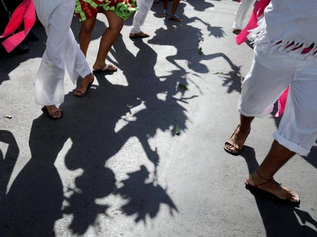Nicaraguans dressed in traditional costumes take part in the ''Poetry Carnival'' during celebrations of the VIII International Poetry Festival in Granada, about 50 kms south of Managua. AFP Photo/ Elmer Martinez
