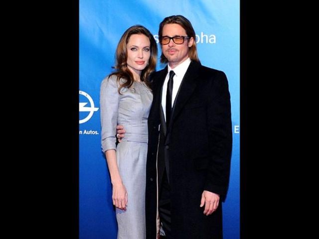 Angelina-Jolie-poses-with-partner-Brad-Pitt-as-they-arrive-for-the-Cinema-for-Peace-gala-in-Berlin Angelina-Jolie-poses-with-partner-Brad-Pitt-as-they-arrive-for-the-Cinema-for-Peace-gala-in-Berlin
