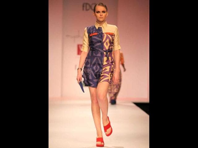 Olga Rymarenk walks the ramp for Kiran and Meghna.