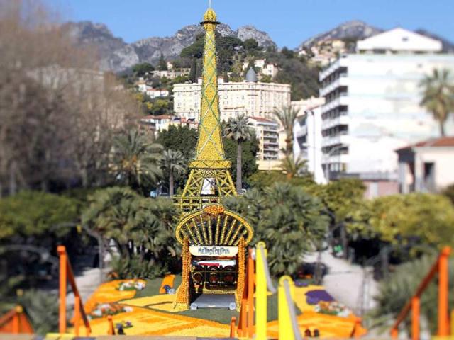 A picture taken with a tilt and shift lens shows sculptures made with oranges and lemons representing the Eiffel tower and the entrance of a metro station in Menton on the French Riviera, ahead of the start of the "Fete du Citron" (lemon carnival). AFP/Valery Hache