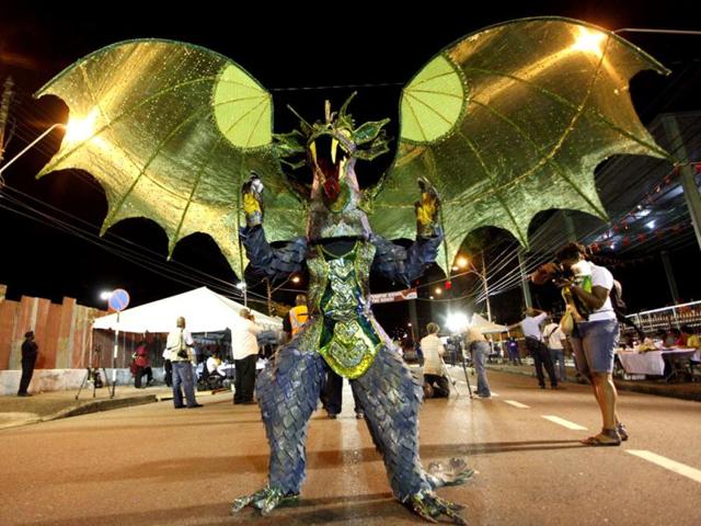 A performer wears a dragon costume during a traditional mas competition at Victoria Square, Port of Spain. Reuters/Andrea De Silva