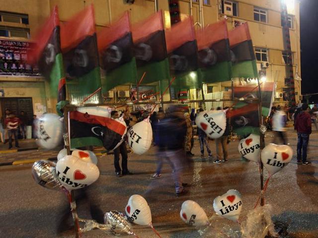 People walk past Kingdom of Libya flags and balloons on sale as they mark the first anniversary of revolutionary uprising against Muammar Gaddafi. Reuters/Esam Al-Fetori