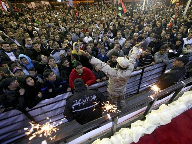 People gather during a celebration to mark the first anniversary of revolutionary uprising against Muammar Gaddafi. Reuters