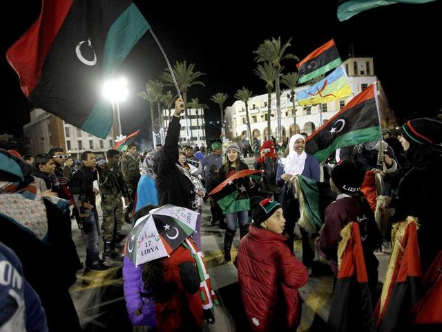 Families celebrate the one-year anniversary since the revolutionary uprising against Muammar Gaddafi, at Martyrs Square in Tripoli. Reuters/Ismail Zitouny