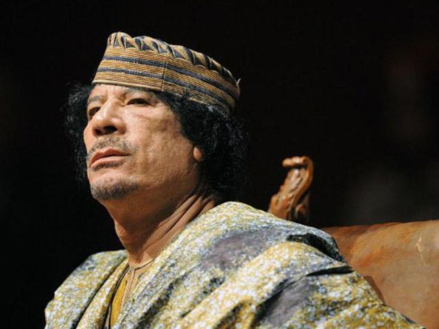 Libyan leader Muammar Gaddafi delivers a speech during a meeting with 700 women from the business, political and cultural spheres. AFP/Christophe Simon, File