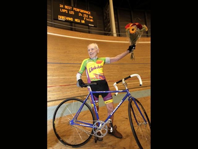 Cyclist Robert Marchand of France celebrates after setting a world record for cycling non-stop for one hour, in the over 100-year-old category, at the Union Cycliste Internationale (UCI) velodrome in Aigle. Reuters/Denis Balibouse