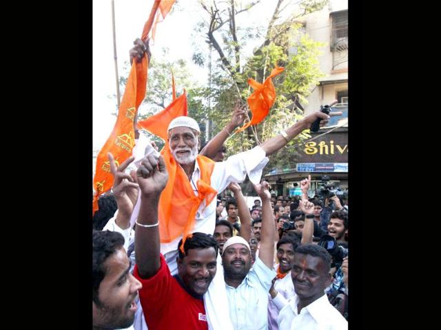 Shiv Sena workers celebrate the party's win in the corporation elections in Mumbai. PTI/Santosh Hirlekar