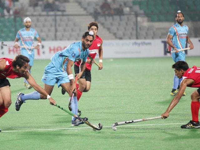 Indian Hockey team player Sarvanjit Singh (11) makes a move against Singapore during the Hero FIH Road to London Delhi 2012, at National Stadium in New Delhi. HT/Ajay Aggarwal