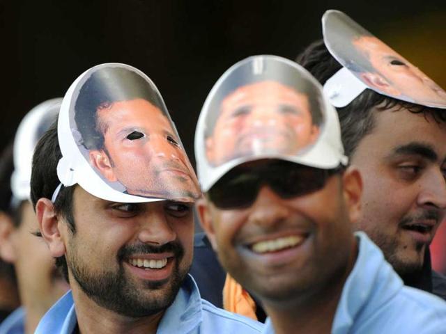 Indian fans wear masks during the one-day international cricket match against Australia in Brisbane. AFP Photo/Greg Wood