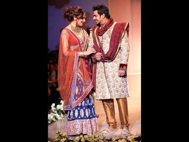Bips looked gorgeous in a maroon and blue lehenga. Madhavan donned a golden-cream sherwani. (HT Photo/Raj K Raj)