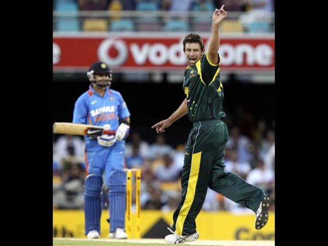 Ben Hilfenhaus, right, appeals for the wicket of Virat Kohli during the one-day international cricket match between Australia and India in Brisbane. AP Photo/Tertius Pickard