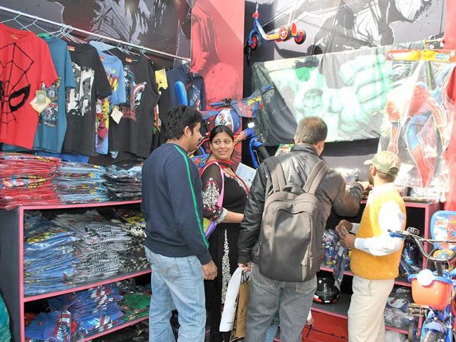 People check out the merchandise at the Avengers stall during the 2nd annual Indian Comic Con in Delhi. HT/Divya Jain