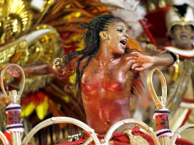 A performer from the Portela samba school parades during carnival celebrations at the Sambadrome in Rio de Janeiro, Brazil. (AP Photo/Victor R. Caivano)