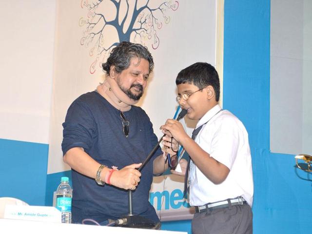 Director Amol Gupte with a student at Hindustan Times Scholarship awards ceremony 2012 in Mumbai. (HT Photo/Prodip Guha)