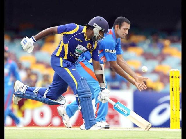 Mahela Jayawardena, left, clashes with Irfan Pathan, in an attempted run out during the One Day International cricket match between Sri Lanka and India in Brisbane. AP/Tertius Pickard
