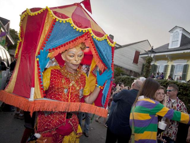 A reveler wearing tents as costume dances during Mardi Gras festivities in New Orleans, Louisiana. Reuters/Lee Celano