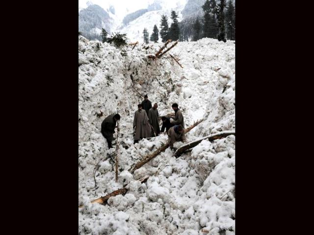 Kashmiri villagers search for their belongings after their huts were buried under snow due to avalanche at Ramwari some 70 km from summer capital Srinagar. At least nine Indian soldiers on duty in the mountains of Kashmir were killed in avalanches overnight with several others missing, officials said. Two avalanches swept through army camps in Dawar and Sonamarg, both near the heavily-militarised Line of Control that divides Kashmir between India and Pakistan. AFP Photo/Rouf Bhat