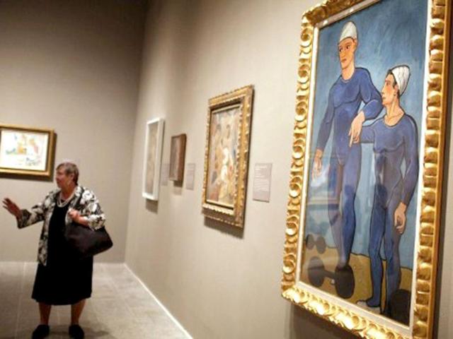 A woman walks through a preview of 'The Steins Collect: Matisse, Picasso, and the Parisian Avant-Garde' at the Metropolitan Museum of Art in New York City. Spencer Platt/Getty Images/AFP