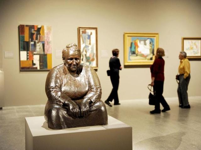 A bronze scupture of Gertude Stein by Jo Davidson in a room with paintings by Pablo Picasso (rear) during a preview of 'The Steins Collect: Matisse, Picasso, and the Parisian Avant-Garde' at the Metropolitan Museum of Art in New York. AFP/Stan Honda