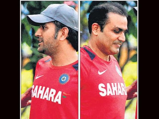 MS-Dhoni-left-and-Virender-Sehwag-reportedly-have-differences-It-seems-to-be-hurting-the-Indian-team-as-they-are-on-a-downward-spiral-India-s-next-match-is-on-Sunday-File-photo MS-Dhoni-left-and-Virender-Sehwag-reportedly-have-differences-It-seems-to-be-hurting-the-Indian-team-as-they-are-on-a-downward-spiral-India-s-next-match-is-on-Sunday-File-photo